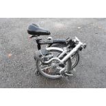 Brompton folding bicycle supplied by Dave Bater Cycles, Bristol, in black, together with a