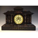 Late 19th Century French rouge marble and black slate temple mantel clock, with cream Arabic dial