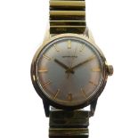 Garrard - Gentleman's yellow metal wristwatch, silvered dial with baton hour markers and centre