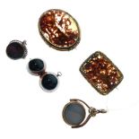 Two hardstone bar brooches, two bloodstone swivel fobs, and an agate ball locket (5)