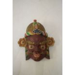 Carved South East Asian polychrome decorated mask, 39cm high