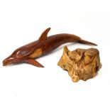 Carved hardwood figure of a dolphin, 94cm long, and a roughly finished tree stump