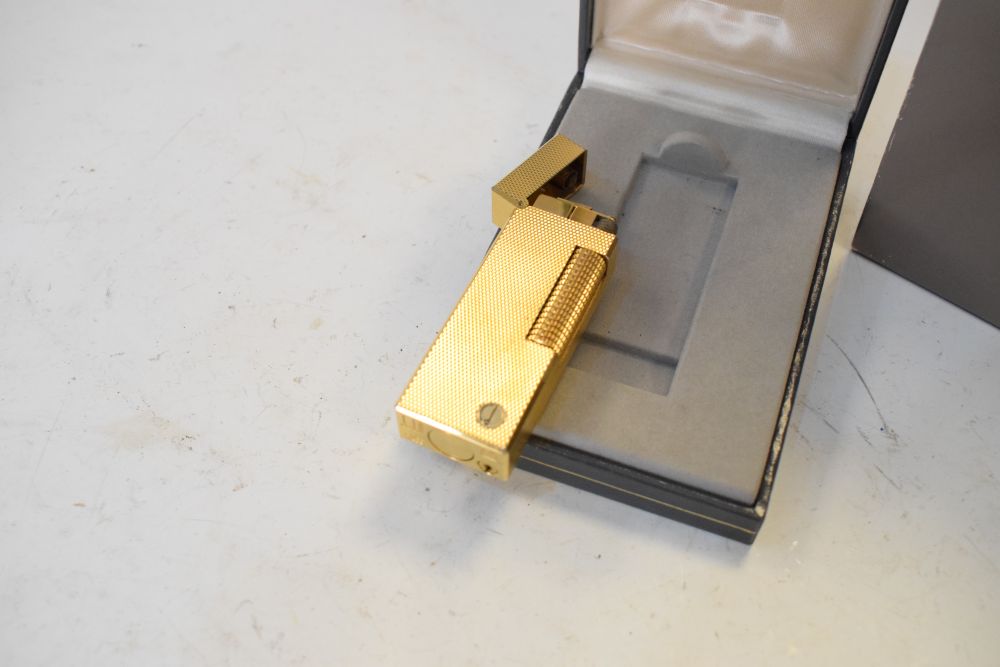 Dunhill - Gold-plated lighter, 6.5cm high, with original box and booklet - Image 4 of 4