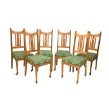 Set of six Arts & Crafts oak high back dining chairs having pierced Art Nouveau design splats