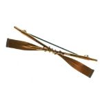 Rowing Interest - Unmarked yellow metal bar brooch designed as crossed oars, 5cm wide, 5g gross