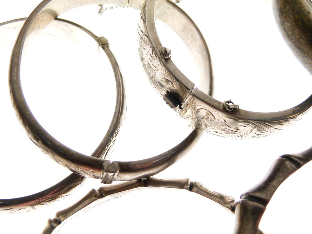 Six assorted silver and white metal snap bangles to include; two of simulated bamboo design, 3. - Image 4 of 6