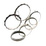 Six assorted silver and white metal snap bangles to include; two of simulated bamboo design, 3.