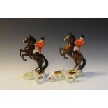 Two Beswick Huntsman, 868, 24cm high, together with three Foxhounds