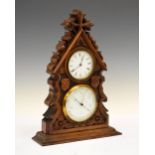 Early 20th Century carved oak combination timepiece barometer, with white Roman dial over aneroid