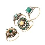 Four 9ct gold dress rings, each set green stones, one additionally set pearls, another opal, 12g
