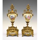 Pair of Continental gilt metal and ceramic urns, 32cm high