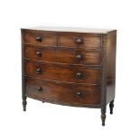 19th Century bowfront chest of drawers having turned spiral and lotus leaf decorated column