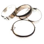 Four assorted silver and white metal bangles comprising one of adjustable buckle belt design and