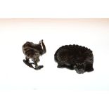 Two Japanese bronze models of an elephant with trunk raised, 4.8cm high and a sleeping dragon, 5.8cm