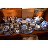 Large quantity of blue transfer-printed Willow pattern dinner ware