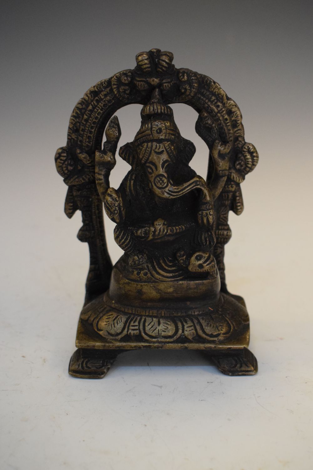 Indian bronze model of Ganesh seated beneath arch, 12cm high, together with a smaller deity (2) - Image 5 of 8