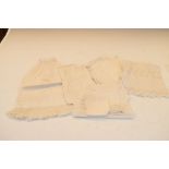 Small group of Victorian lace-trimmed white linen dolls costumes and clothes