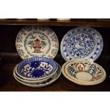 Two Continental faience chargers, and a quantity of hand painted bowls