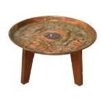 Oriental copper finish cast metal circular tray depicting four relief dragons within a foliate