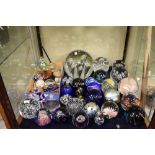 Large quantity of glass paperweights, largest 18cm high
