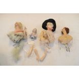 Quantity of partial bisque headed dolls in various outfits, tallest 14cm