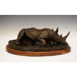 Nola Steele (South African) - Bronze sculpture - 'White Rhino', a rhinoceros reclining on