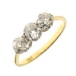 Three stone diamond ring, the yellow mount stamped '18ct', the old brilliant cuts totalling
