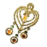 Citrine and green tourmaline heart shaped pendant brooch, tagged '750', 5cm long, 11g gross