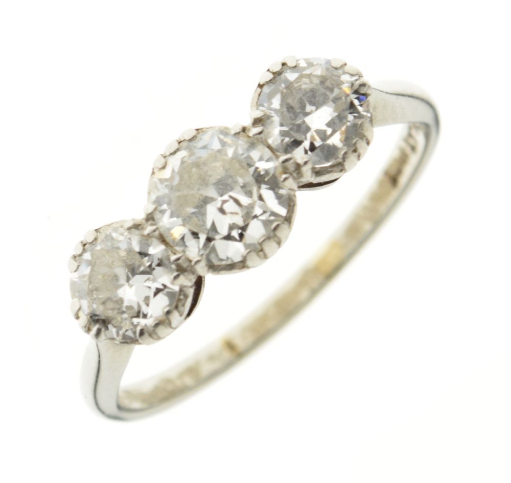 Three stone diamond ring, the white mount stamped 'Plat 18ct', the graduated brilliant cuts of