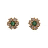 Pair of diamond and emerald cluster ear studs, set in yellow metal, the central emerald enclosed