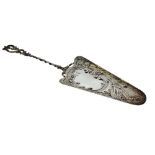 Late 19th Century Continental white metal fish/cake slice, with rococo style decoration and twist