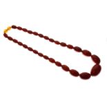 Graduated row of amber beads, 53g gross Condition: Thirty-one (31) beads in total. The two orange