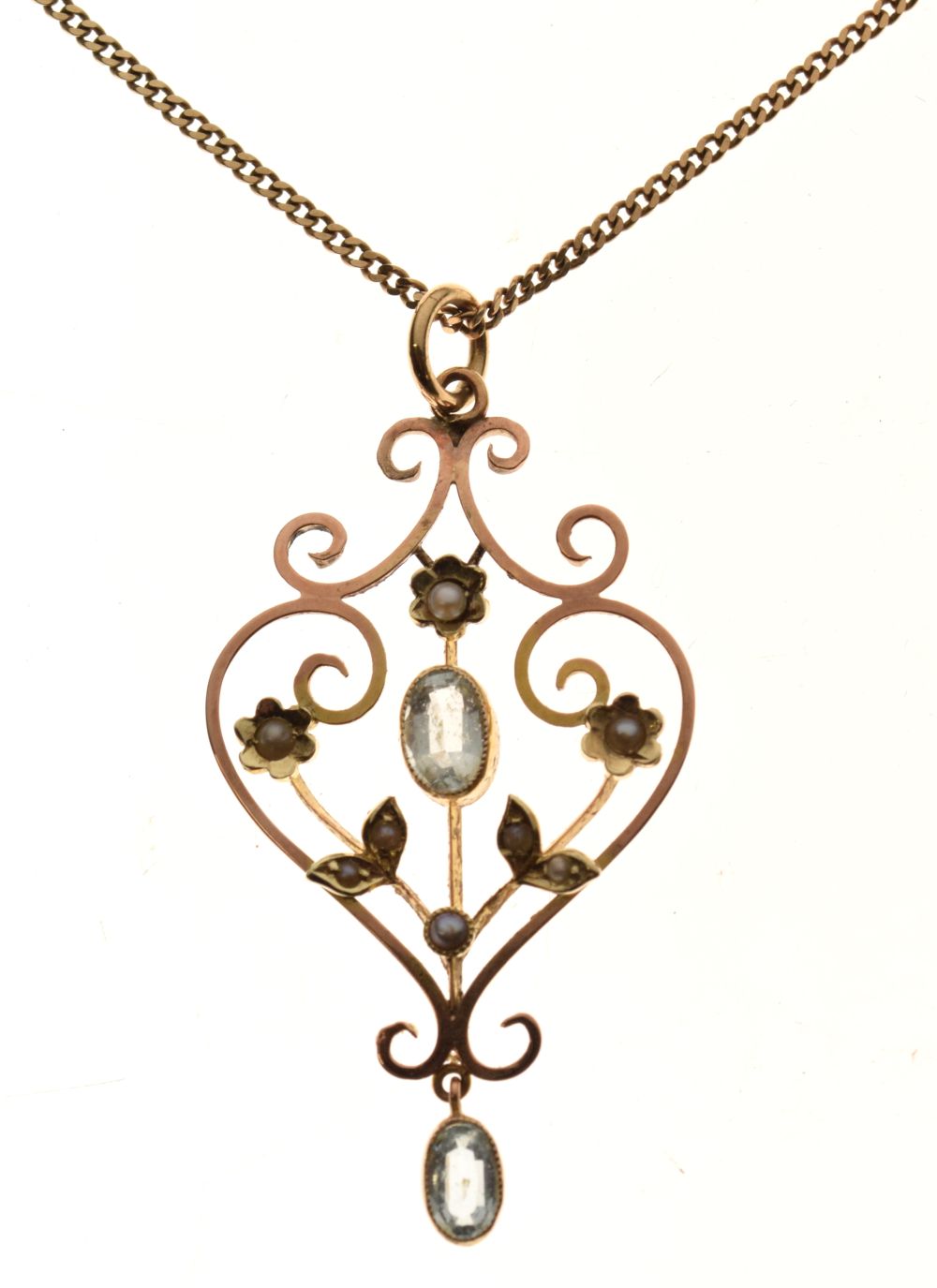 Edwardian style aquamarine and seed pearl pendant in unmarked gold, on a 9ct gold chain, 4.4g