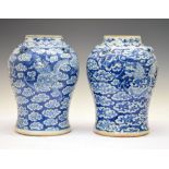 Pair of Chinese blue and white porcelain baluster jars, each having four mask lug handles to the