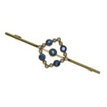 Sapphire and seed pearl bar brooch, indistinct tag, the central sapphire enclosed by an open