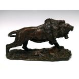 Otto Jarl (Swedish, 1856-1915) - Patinated bronze figure of a lion, one forepaw resting upon an