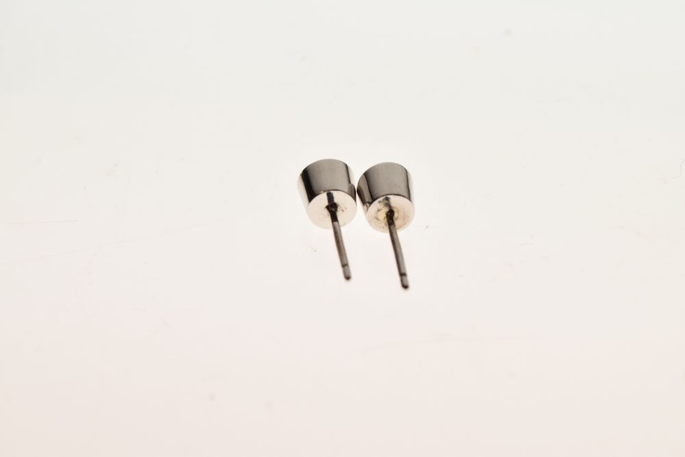 Pair of single stone diamond ear studs, the brilliant cut stones totalling approximately 0.7 - Image 3 of 4
