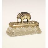 Edward VII silver pin cushion, in the form of an elephant standing on a silver lidded glass pin