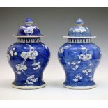 Pair of Chinese blue and white porcelain baluster prunus jars and covers, four-character mark