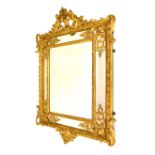 19th Century French giltwood and gesso wall mirror, the shallow-bevelled rectangular main plate