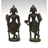 Pair of 18th or 19th Century Indian bronze figures, each modelled as an attendant with top-knot