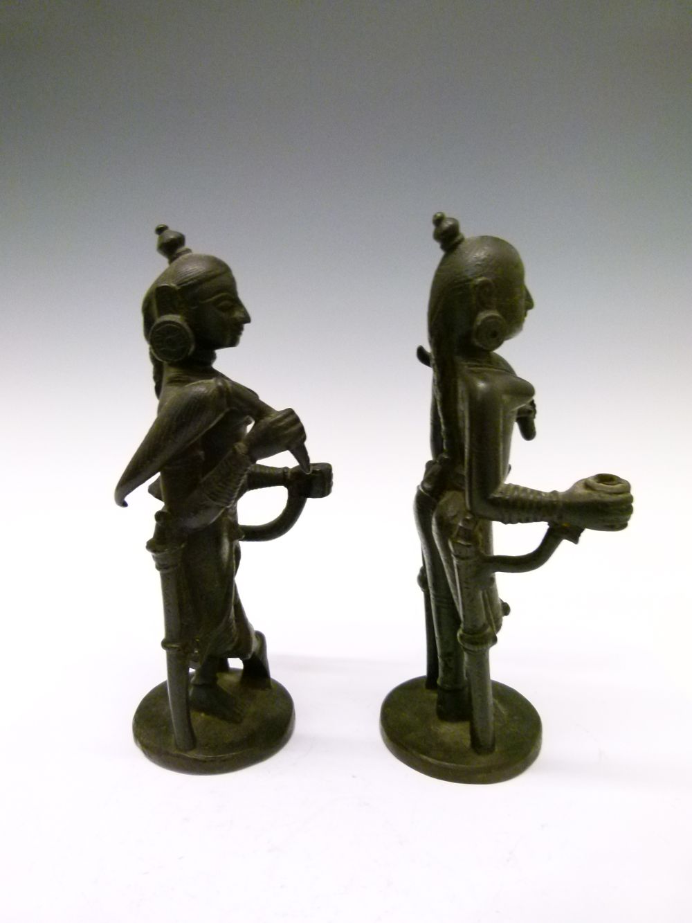 Pair of 18th or 19th Century Indian bronze figures, each modelled as an attendant with top-knot - Image 3 of 7