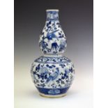 Chinese blue and white porcelain double gourd vase, probably 19th Century, decorated with a frieze