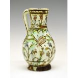 Iznik faience pottery ewer or jug vase, Ottoman Turkey, circa 1600, the piriform body decorated in
