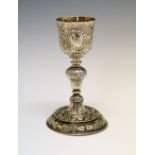 19th Century white metal goblet, standing on a circular foot with later chased decoration, unmarked,