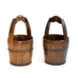 Pair of Chinese iron-bound pine rice buckets, of coopered design, 33cm diameter x 62cm high