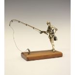 Late 20th Century white metal figure of a fisherman, standing on a wooden base, stamped 925, 8.