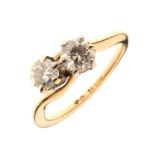 Two stone diamond crossover ring, the yellow mount stamped '18ct', the brilliant cut of