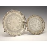 Set of two Victorian silver salvers, with engraved decoration and pierced swag borders, each