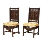 Pair of 19th Century carved oak chairs, each stippled in relief with a pair of full-length portraits